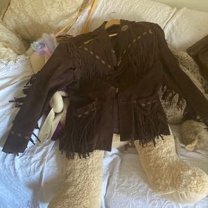 This is a genuine Indian leather actually suede coat. Beautiful.